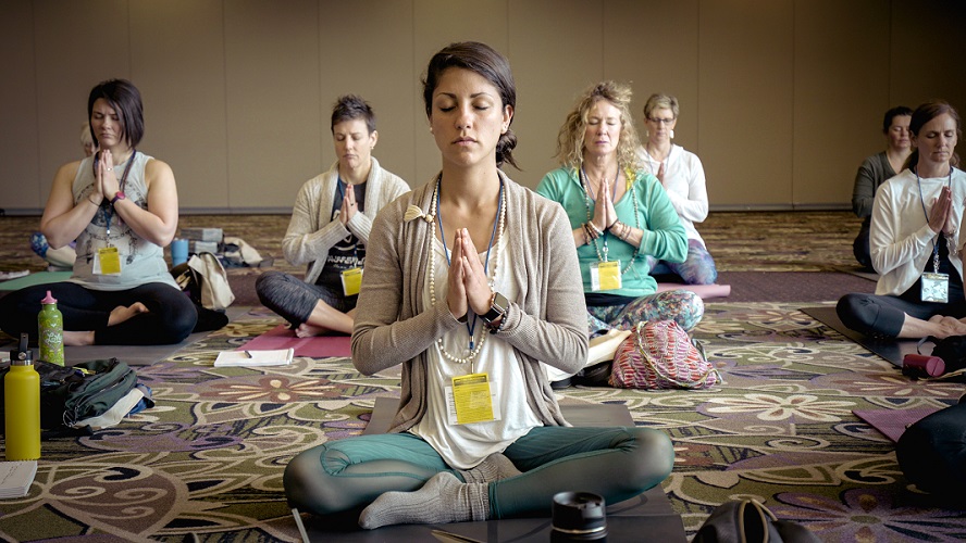 woman meditating to reduce stress